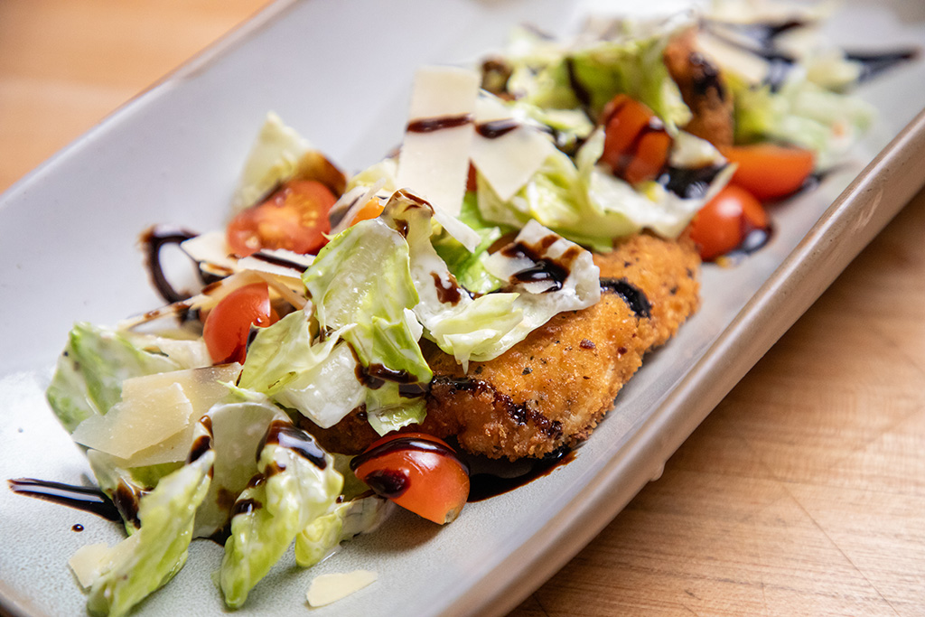 Caesar Salad over Crispy Chicken Cutlets